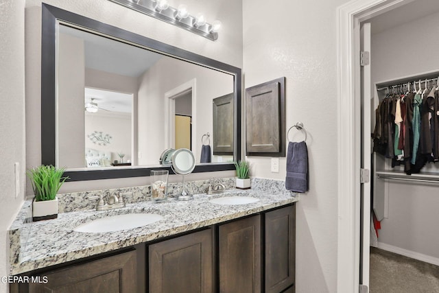 bathroom featuring vanity and ceiling fan