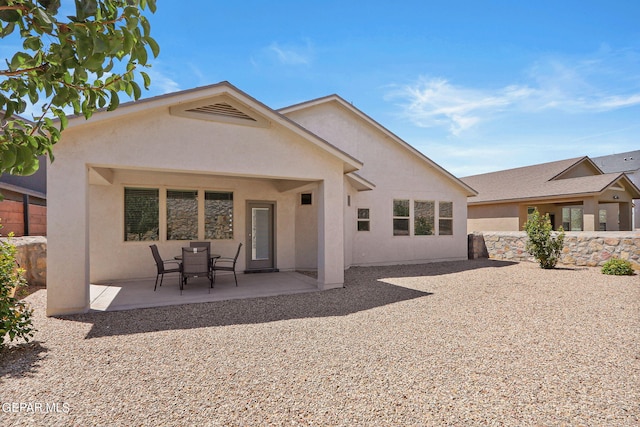 rear view of house featuring a patio area