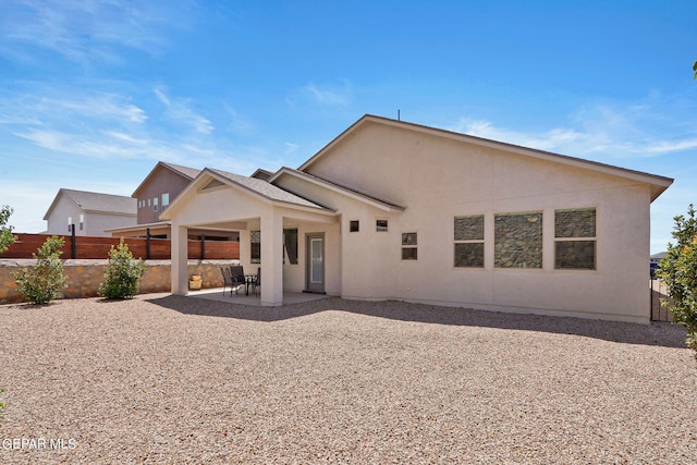 rear view of property featuring a patio area