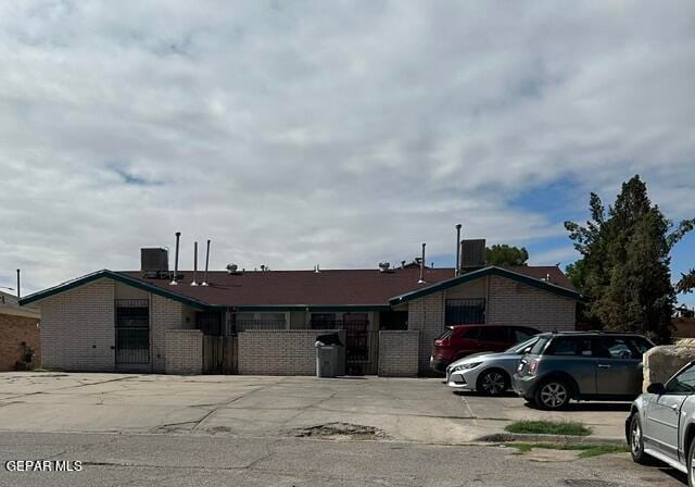 ranch-style home featuring cooling unit