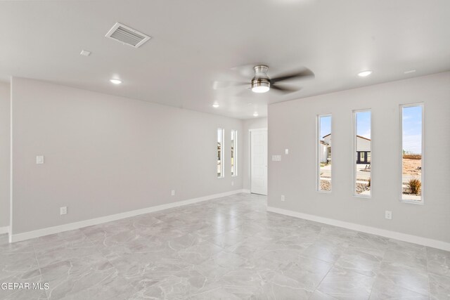 spare room featuring ceiling fan
