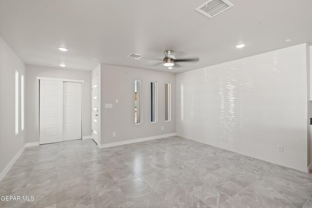 spare room with ceiling fan