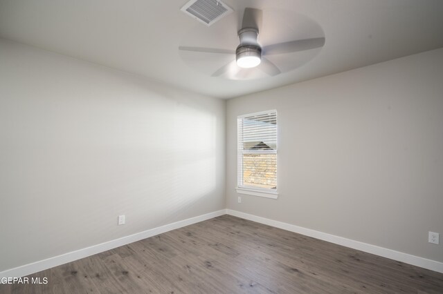 unfurnished room with ceiling fan and wood-type flooring