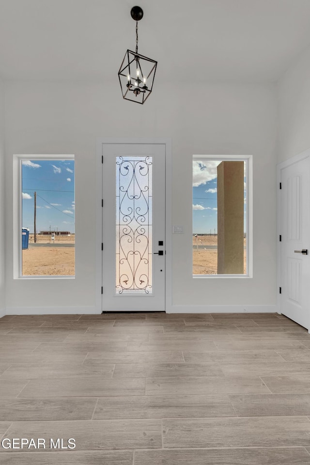 1385 Syrian Desert Dr, Chaparral, NM 88081 - entrance foyer featuring a chandelier and light wood-type flooring