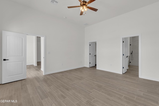 1385 Syrian Desert Dr, Chaparral, NM 88081 - spare room with ceiling fan, light wood-type flooring, and a high ceiling