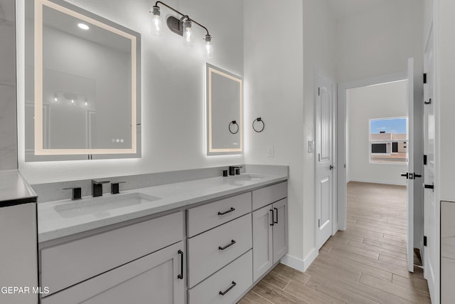 1385 Syrian Desert Dr, Chaparral, NM 88081 - bathroom with double vanity and wood finished floors
