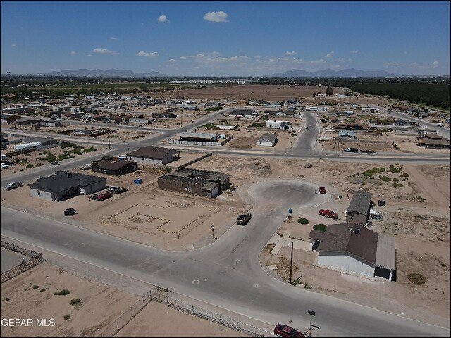 birds eye view of property featuring a mountain view