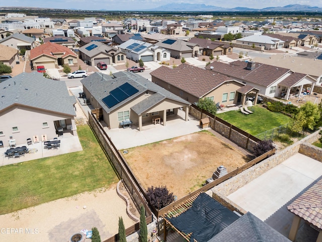 drone / aerial view featuring a residential view and a mountain view