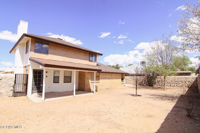 rear view of property featuring a patio