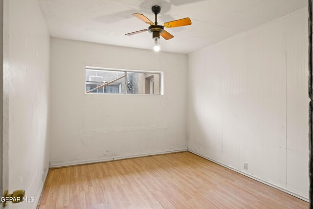 spare room featuring ceiling fan and light hardwood / wood-style flooring