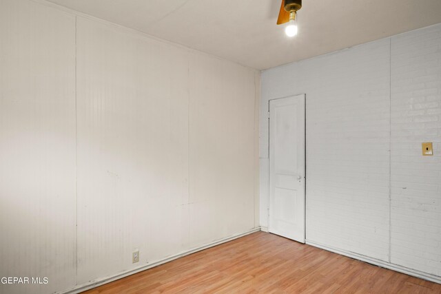 unfurnished bedroom with hardwood / wood-style flooring