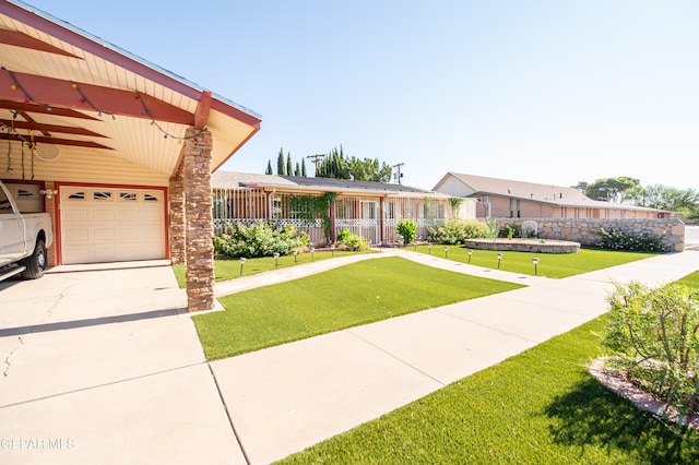 ranch-style home featuring a front yard and a garage