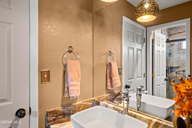 bathroom featuring vanity and a tile shower