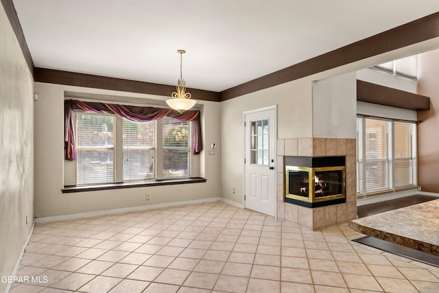 unfurnished living room with a fireplace and light tile patterned flooring