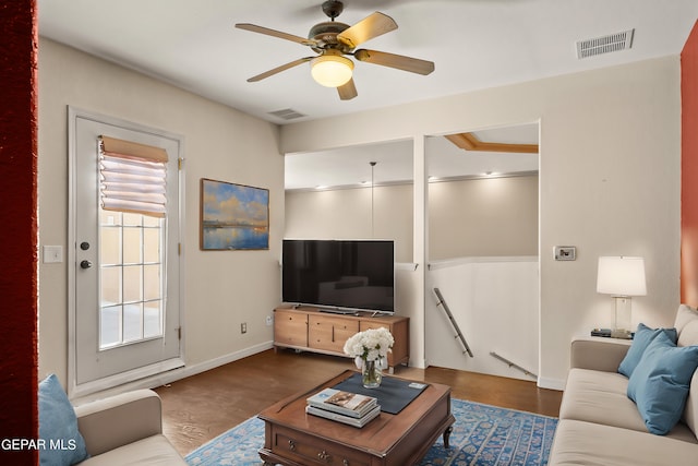 living room with ceiling fan and wood-type flooring