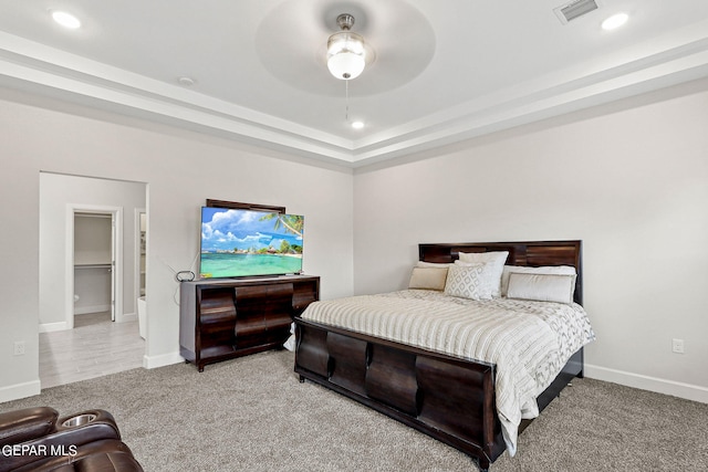 bedroom featuring light carpet and ceiling fan