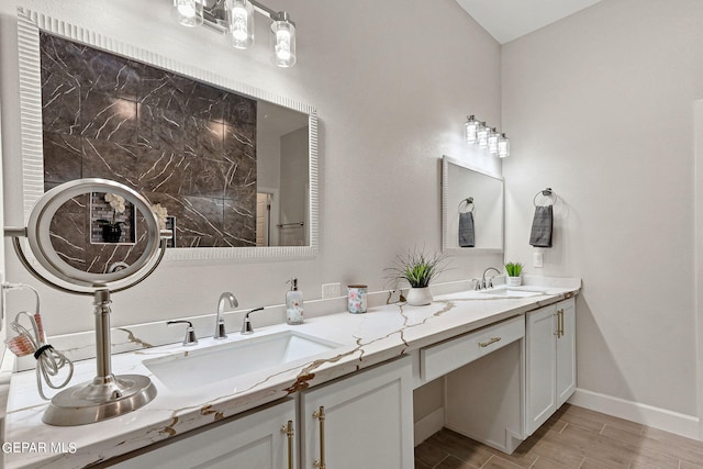 bathroom with vanity and hardwood / wood-style floors