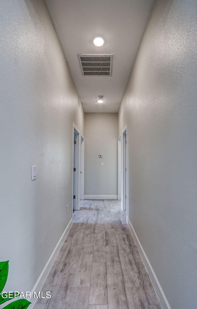 hallway featuring light hardwood / wood-style flooring