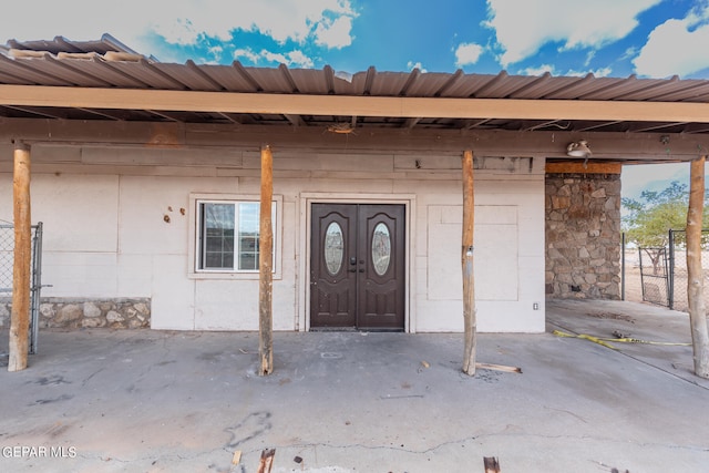 doorway to property featuring a patio