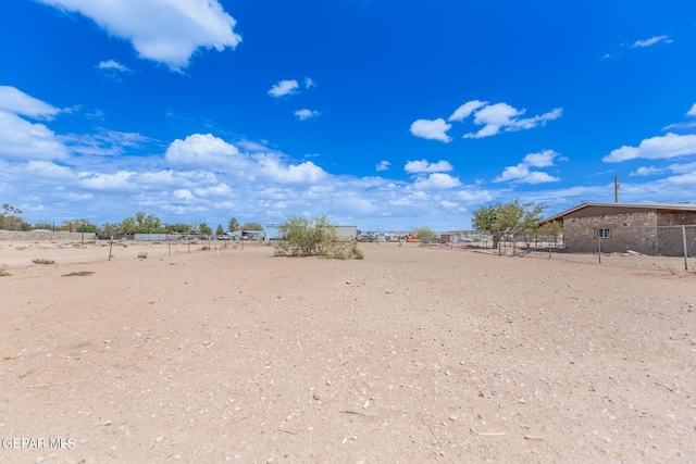 view of yard with a rural view