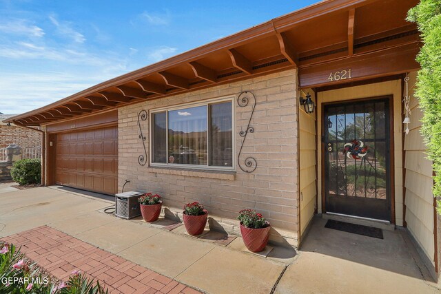 doorway to property featuring a garage