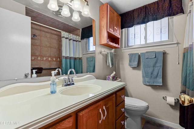 bathroom with a shower with curtain, toilet, and vanity