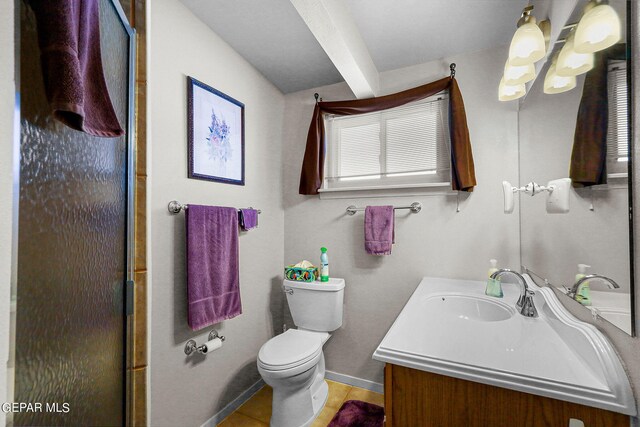 bathroom with vanity, toilet, an enclosed shower, and tile patterned floors