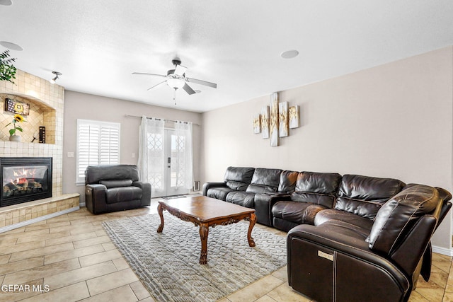 3000 Lookout Point Dr, El Paso, TX 79938 - living area with a tile fireplace, french doors, and a ceiling fan