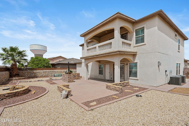 3000 Lookout Point Dr, El Paso, TX 79938 - back of property with a patio area, stucco siding, a balcony, a fenced backyard, and central AC