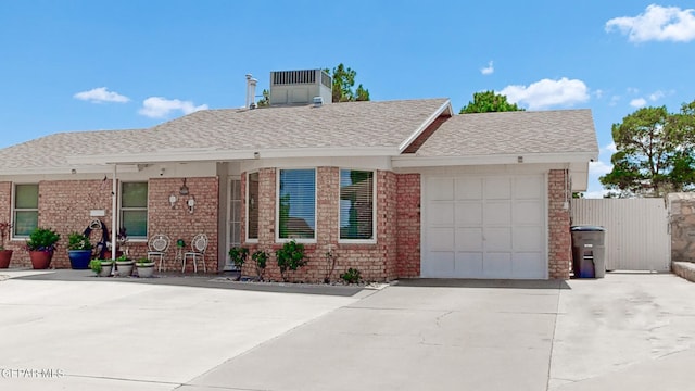 ranch-style home featuring a garage