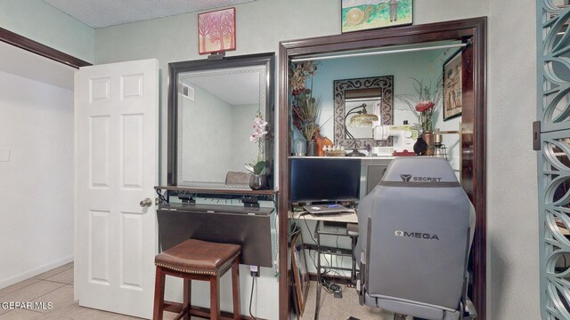 home office featuring light tile patterned floors