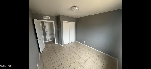 unfurnished bedroom with a closet