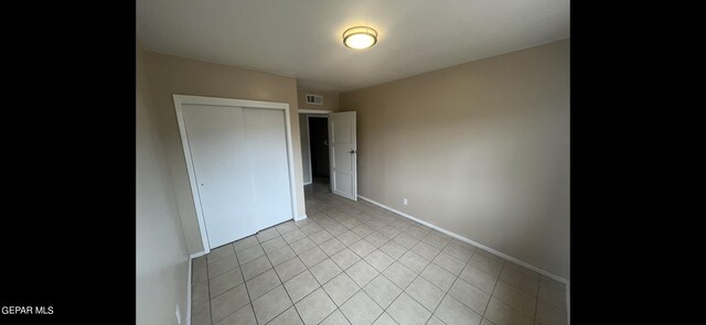 unfurnished bedroom with a closet