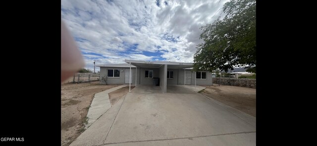 view of front of home with a carport