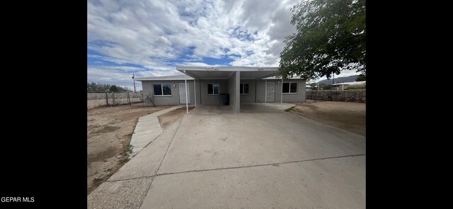 view of front of property with a carport