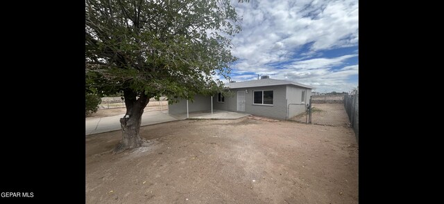 view of property exterior with a patio area