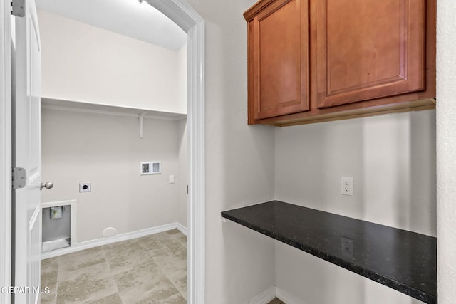 washroom featuring baseboards, cabinet space, hookup for an electric dryer, and washer hookup