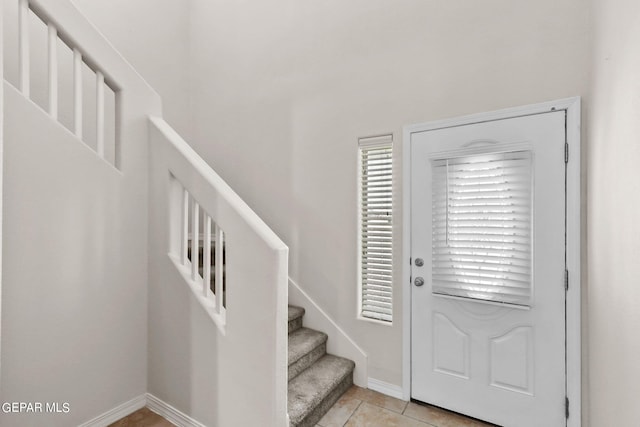 entrance foyer featuring light tile patterned flooring