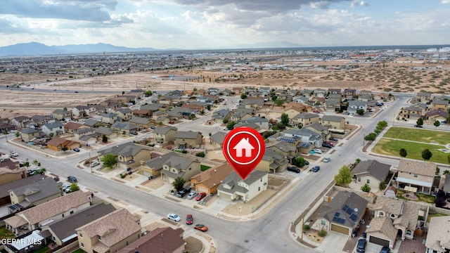 birds eye view of property featuring a mountain view and a residential view