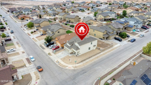 birds eye view of property with a residential view