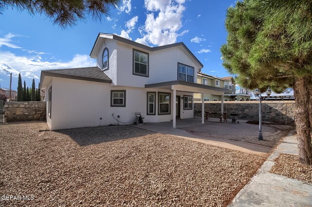 rear view of house featuring a patio