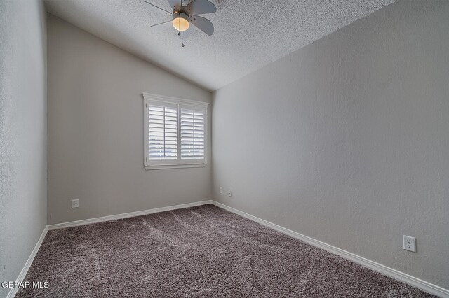 carpeted spare room with ceiling fan, a textured ceiling, and vaulted ceiling