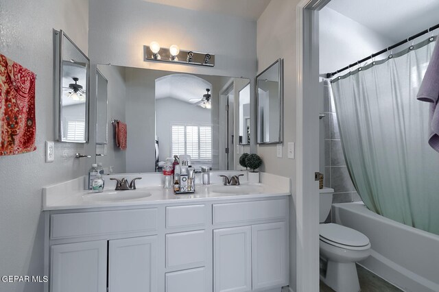 full bathroom with toilet, vanity, ceiling fan, vaulted ceiling, and shower / tub combo