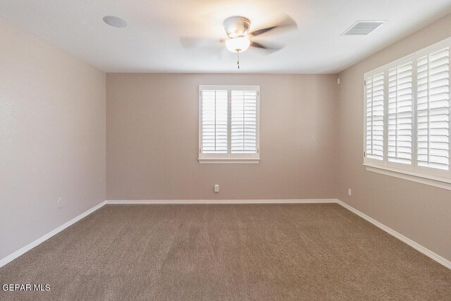 empty room with carpet and ceiling fan