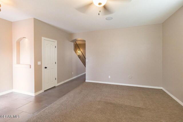 carpeted empty room with ceiling fan