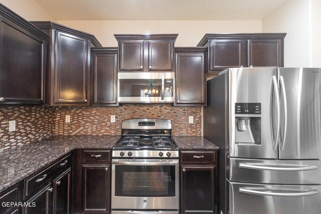 kitchen featuring appliances with stainless steel finishes, dark stone countertops, decorative backsplash, and dark brown cabinetry