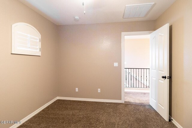 empty room with carpet flooring