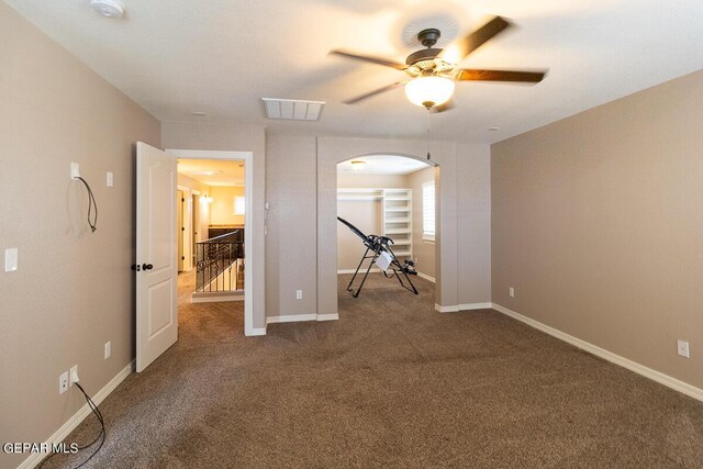 unfurnished room with carpet and ceiling fan