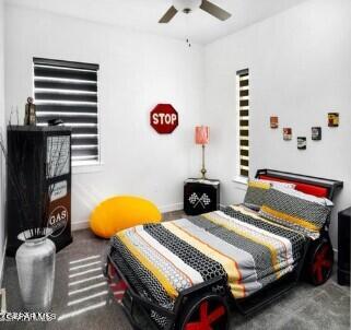 bedroom with ceiling fan and carpet