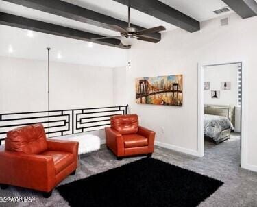 living area featuring carpet, ceiling fan, and beamed ceiling